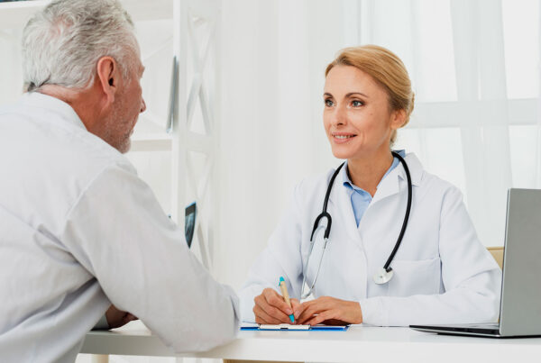 Doctor discussing personalized healthcare options with an older patient during an unhurried visit.