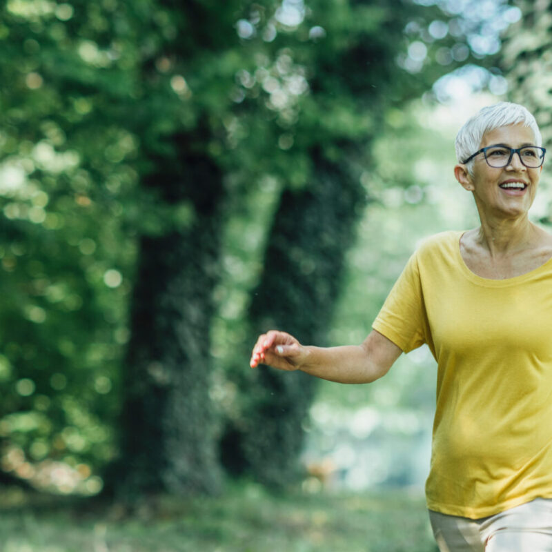 woman over 40 walking outside for health